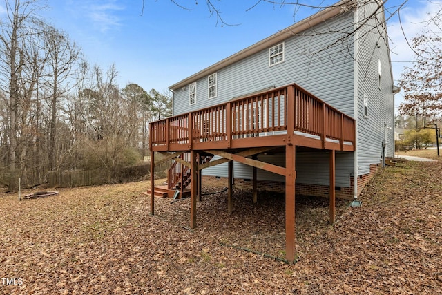 back of property with a wooden deck