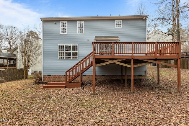 back of property featuring a deck