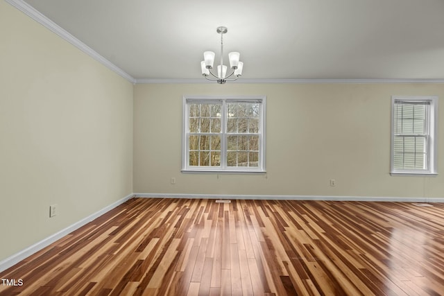 unfurnished room with crown molding, a chandelier, and hardwood / wood-style flooring