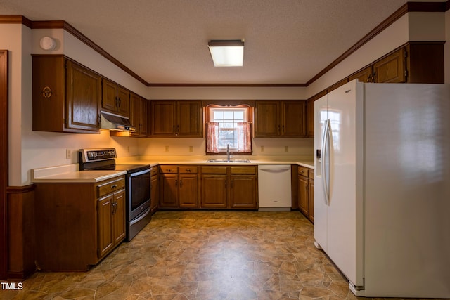 kitchen featuring white appliances, ornamental molding, sink, and a textured ceiling