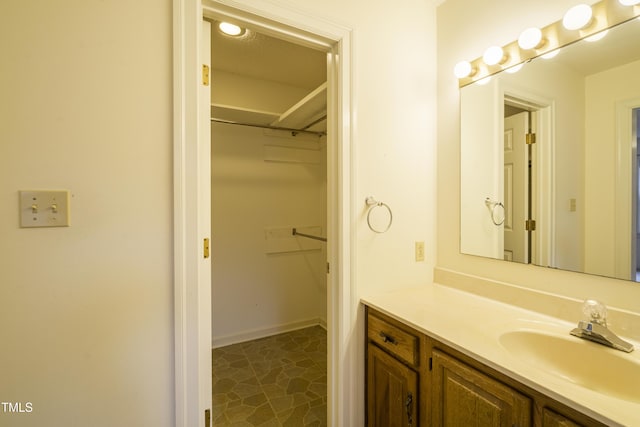 bathroom featuring tile patterned flooring and vanity