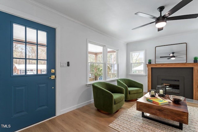 interior space featuring crown molding, ceiling fan, and hardwood / wood-style floors