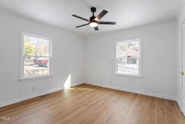 empty room with crown molding, ceiling fan, and light hardwood / wood-style floors