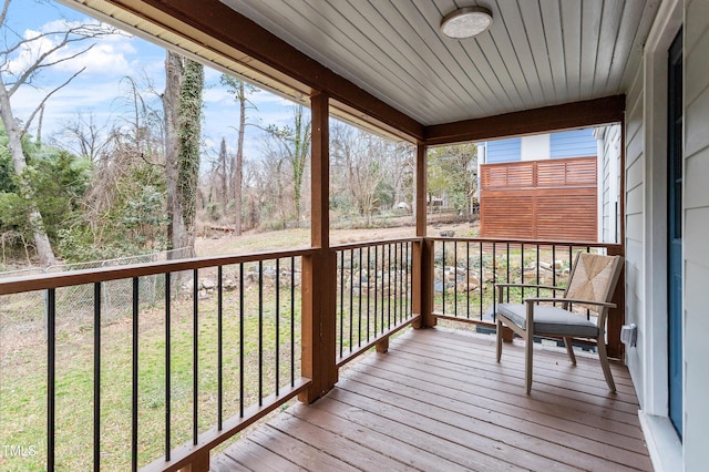 wooden terrace with a yard