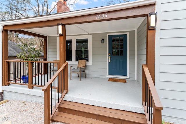 doorway to property featuring a porch