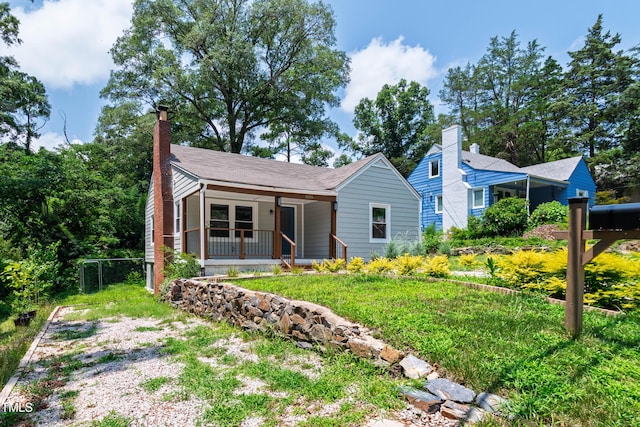 1606 James St, Durham, NC 27707 - view of front facade with a porch and a chimney