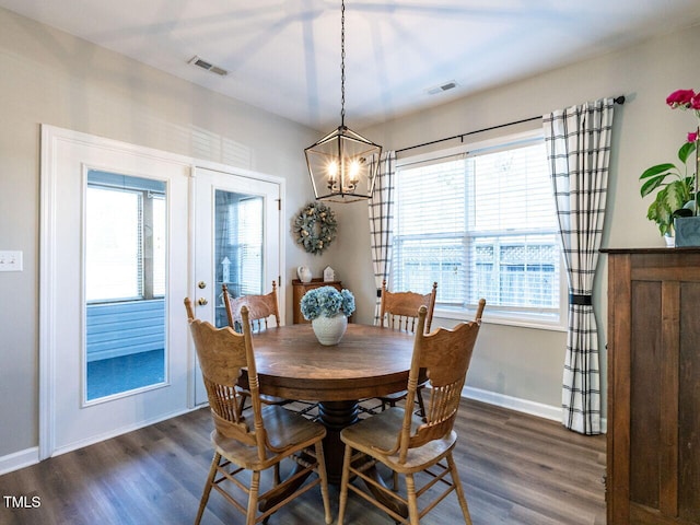 dining area with french doors, visible vents, dark wood finished floors, and baseboards