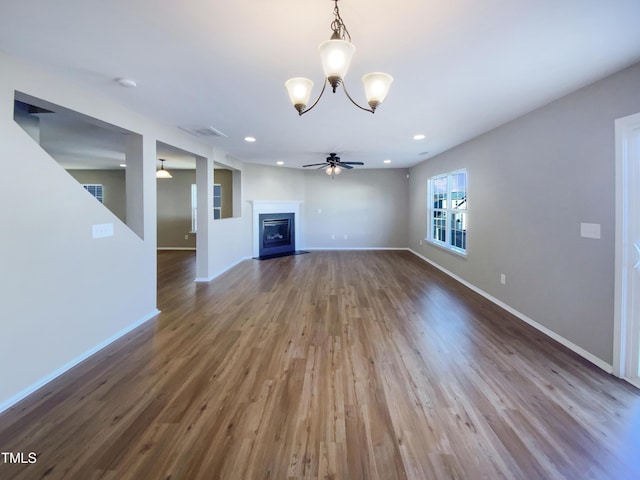 unfurnished living room featuring ceiling fan and wood-type flooring