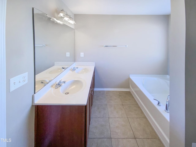 bathroom with a tub, tile patterned flooring, and vanity