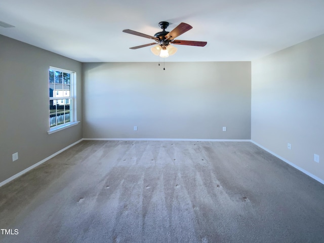 carpeted empty room featuring ceiling fan