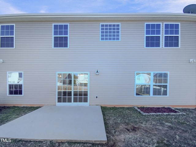 rear view of house featuring a patio