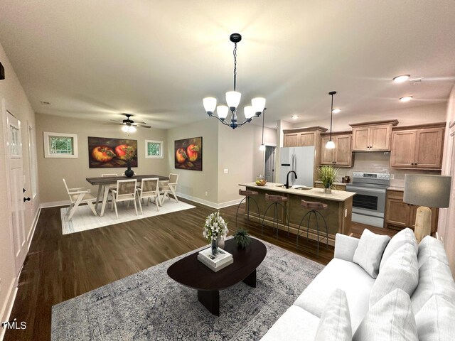 315 S Maple Ave, Kenly, NC 27542 - living area with baseboards, dark wood finished floors, a chandelier, ceiling fan, and recessed lighting