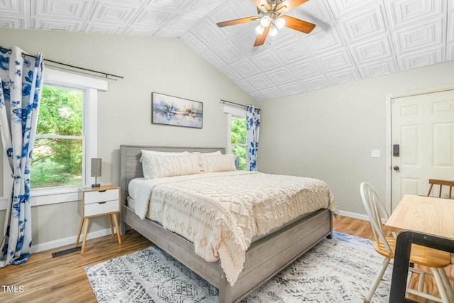 bedroom with ceiling fan and light hardwood / wood-style floors