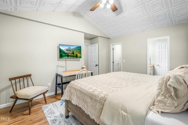 bedroom featuring ceiling fan, connected bathroom, and light hardwood / wood-style flooring