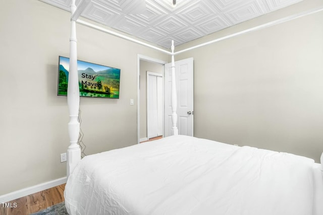 bedroom featuring wood-type flooring