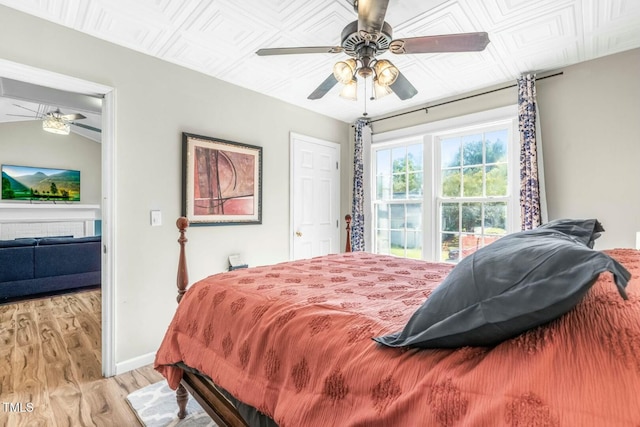 bedroom featuring light wood-type flooring and ceiling fan