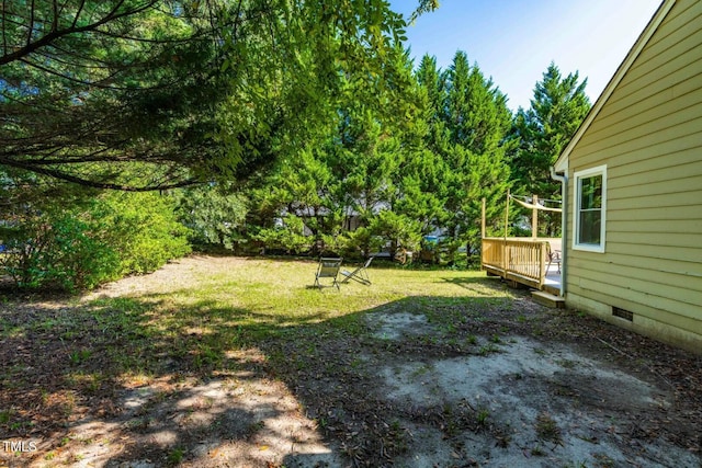 view of yard with a wooden deck