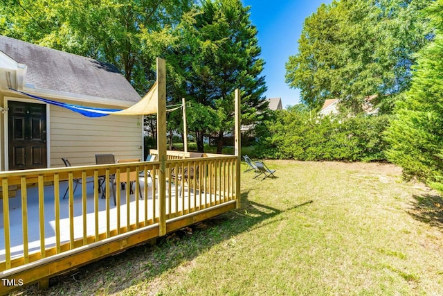 view of yard featuring a wooden deck