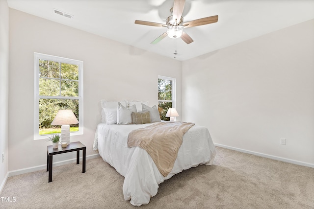 carpeted bedroom with ceiling fan