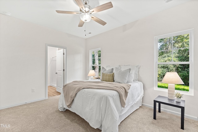 carpeted bedroom with ceiling fan