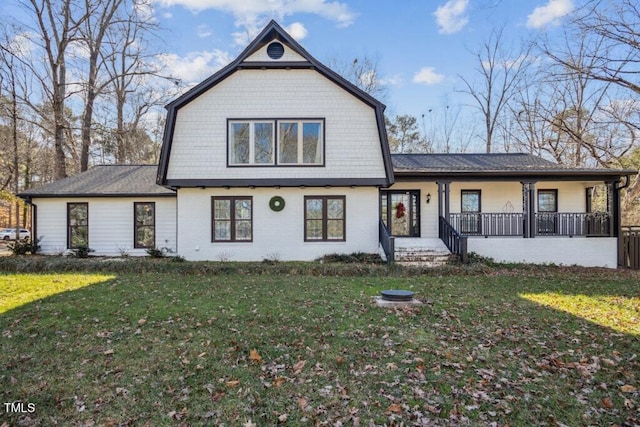 front facade with a porch and a front lawn