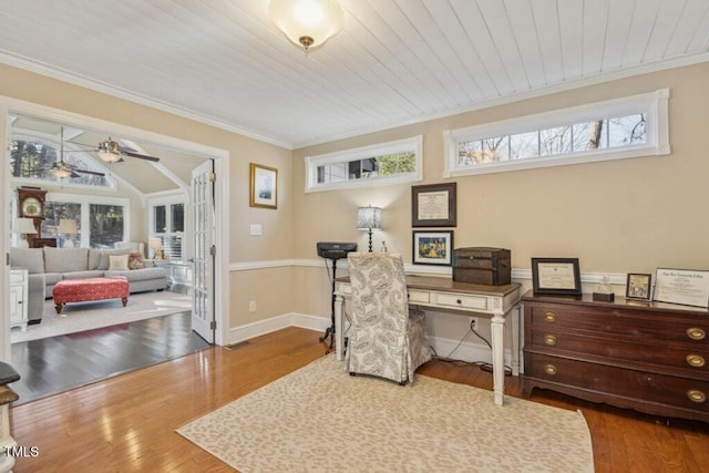 office space featuring wood ceiling, ornamental molding, wood-type flooring, and ceiling fan