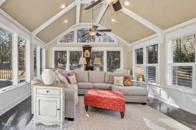 sunroom / solarium with plenty of natural light, ceiling fan, and vaulted ceiling