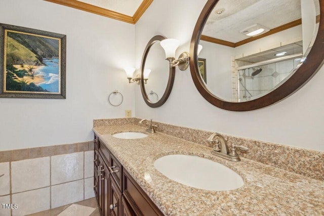 bathroom with vanity, crown molding, a shower with shower door, and tile patterned floors