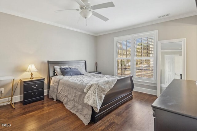 bedroom with ornamental molding, dark hardwood / wood-style floors, and ceiling fan