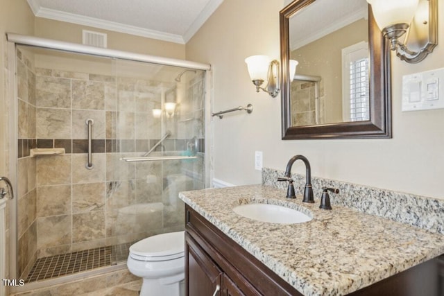 bathroom featuring an enclosed shower, ornamental molding, vanity, and toilet