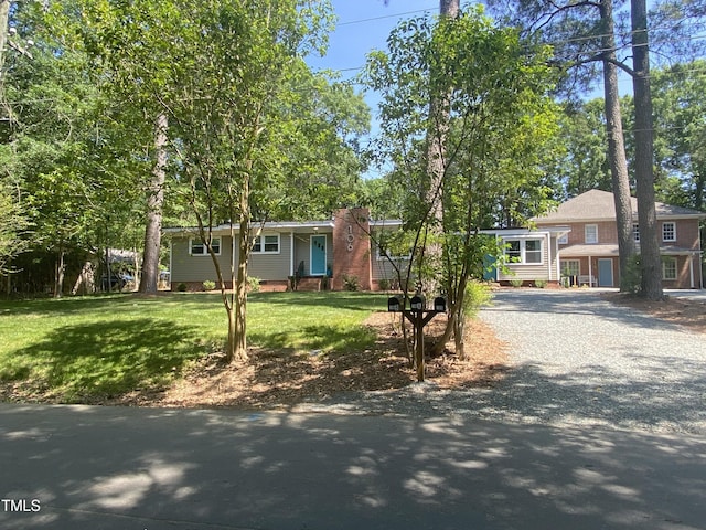 ranch-style home with a front yard