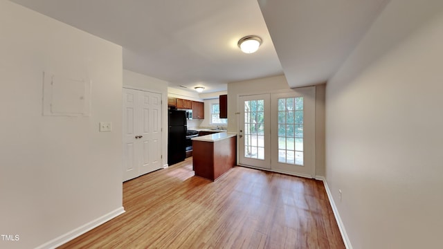 kitchen featuring sink, stainless steel appliances, and light hardwood / wood-style floors