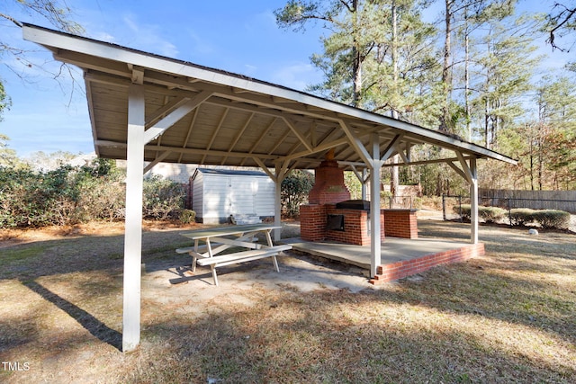 exterior space featuring a patio area, a shed, and a gazebo