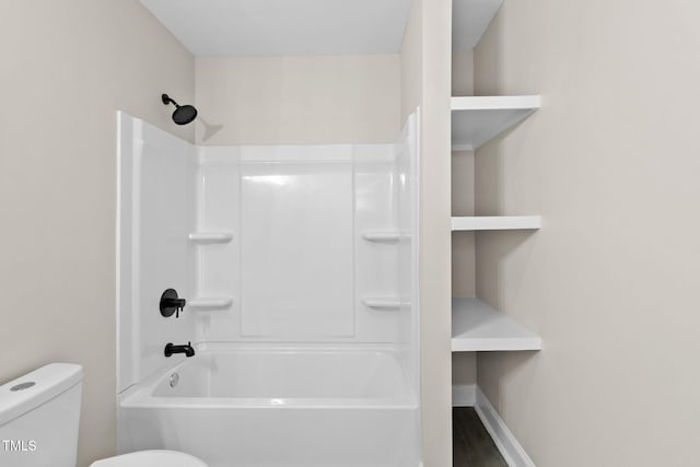 bathroom with toilet and shower / bathtub combination