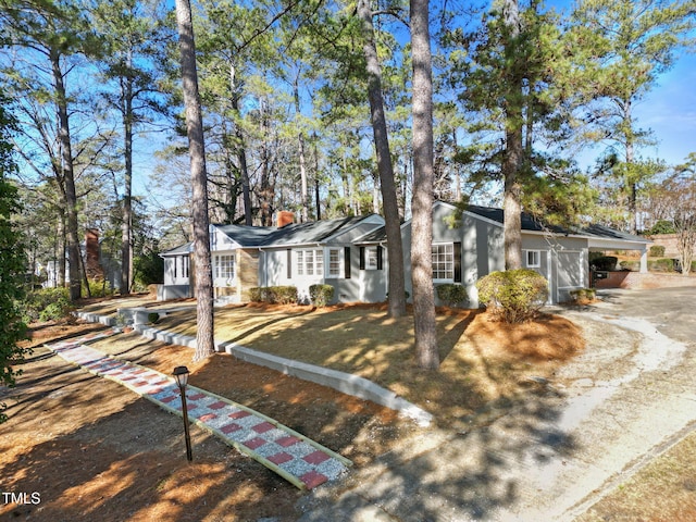 ranch-style home with a carport