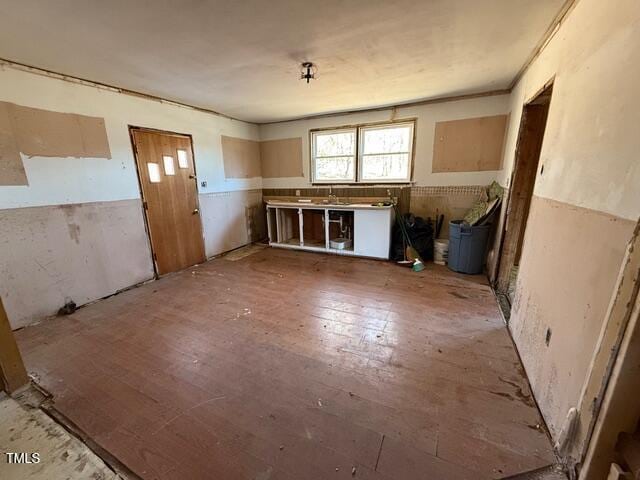 misc room with sink and wood-type flooring