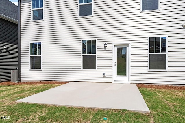 doorway to property featuring a lawn and a patio area