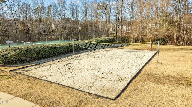 surrounding community featuring tennis court