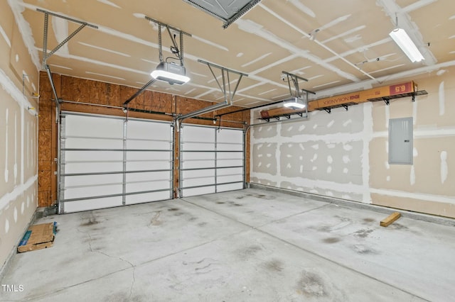 garage with electric panel and a garage door opener