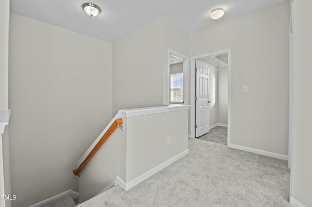 corridor with light colored carpet