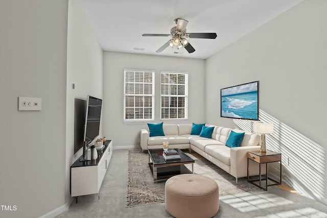 living room featuring ceiling fan and light carpet