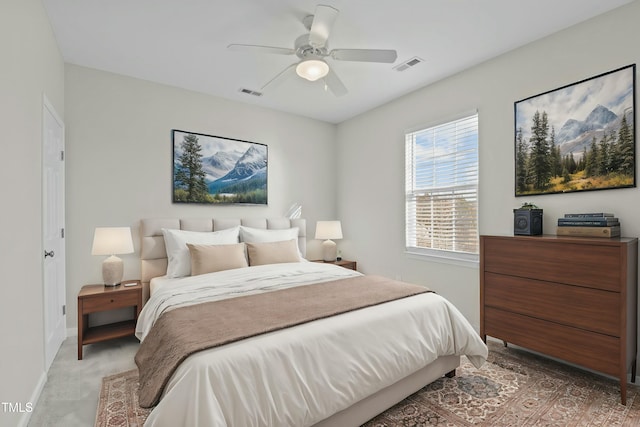 bedroom featuring ceiling fan and light carpet