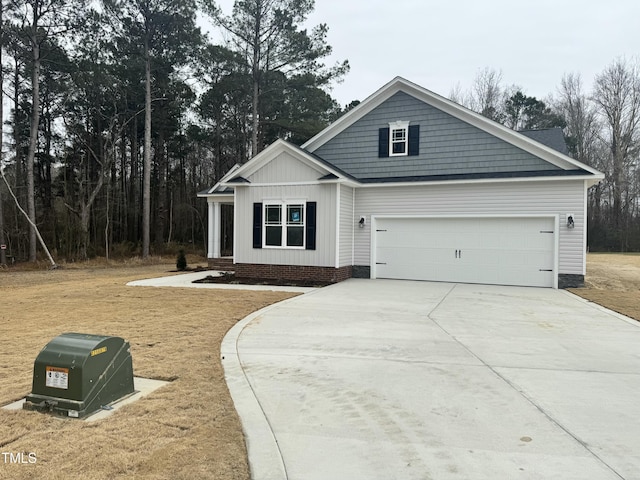 view of front of property featuring concrete driveway and board and batten siding