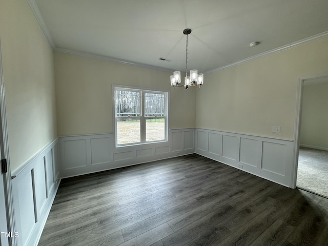 unfurnished dining area featuring an inviting chandelier, visible vents, dark wood-style flooring, and crown molding