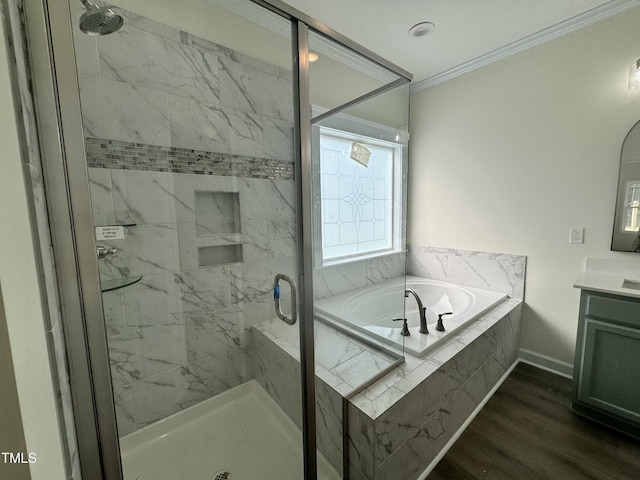 full bath with a bath, a shower stall, vanity, and crown molding