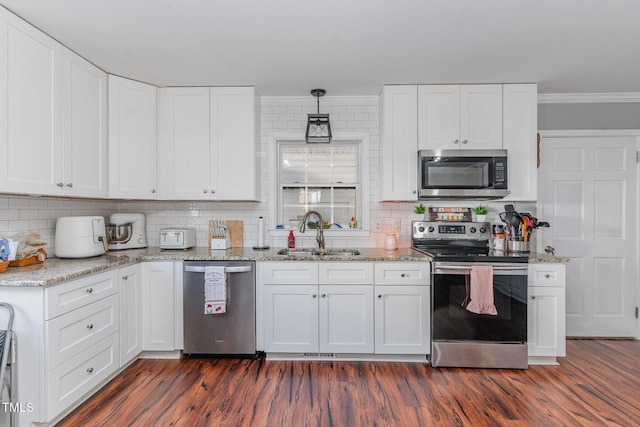 kitchen with sink, stainless steel appliances, and white cabinetry