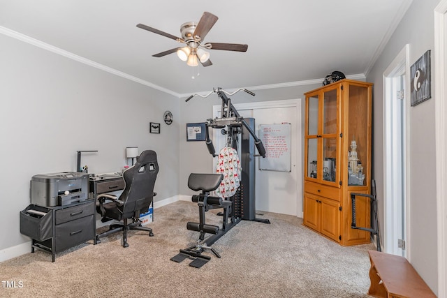 carpeted office space with crown molding and ceiling fan