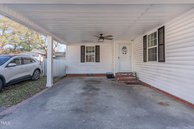 view of patio / terrace featuring ceiling fan and a carport