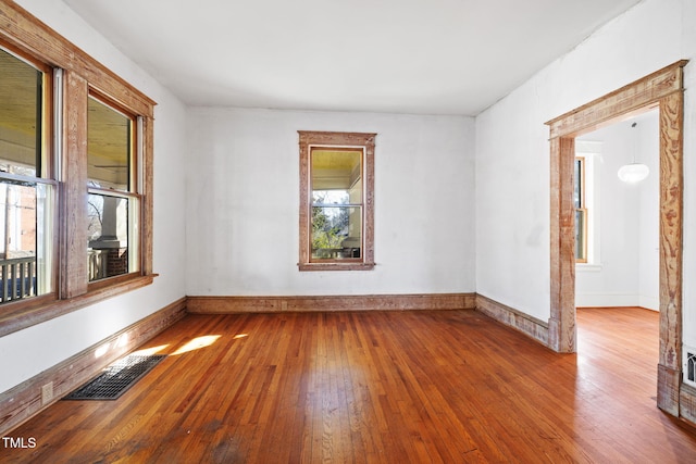 spare room with light hardwood / wood-style flooring