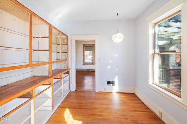 dining space featuring wood-type flooring